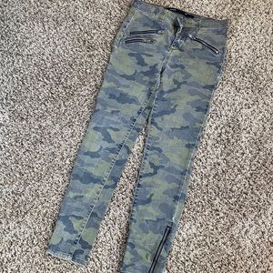 Cami skinny jeans with zippers on the bottom sides.